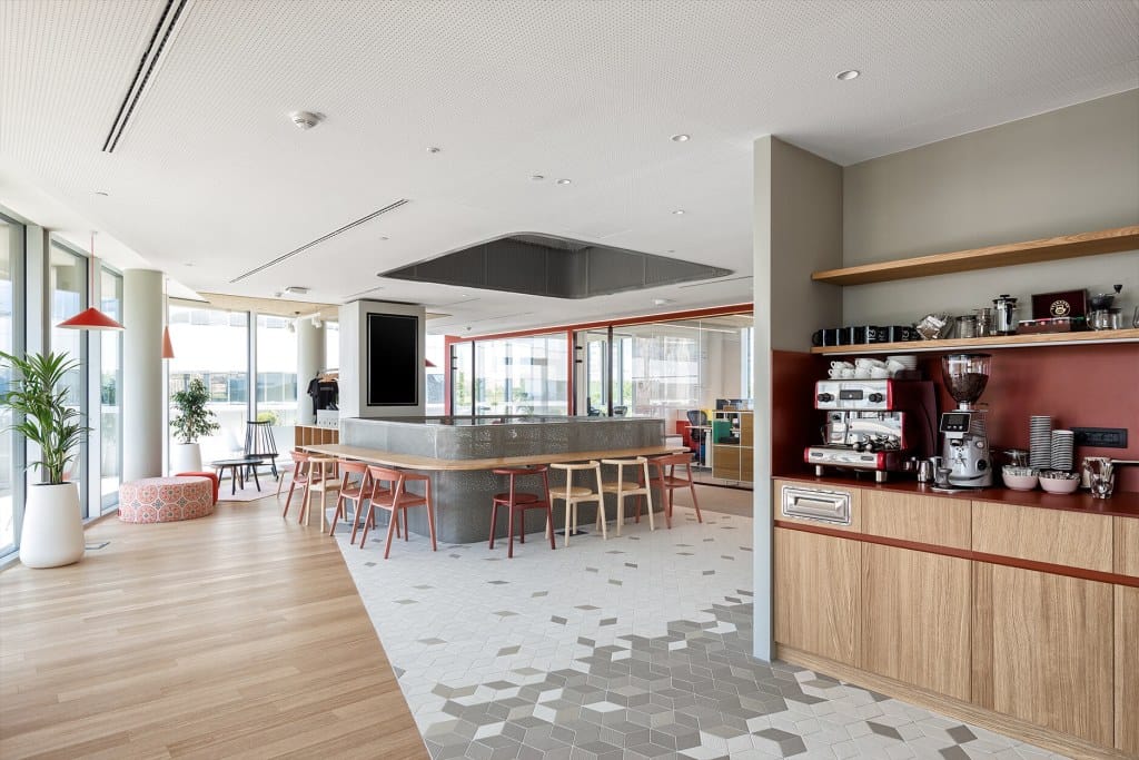 coffee point with warm brick tones in Nordeus workspace interior