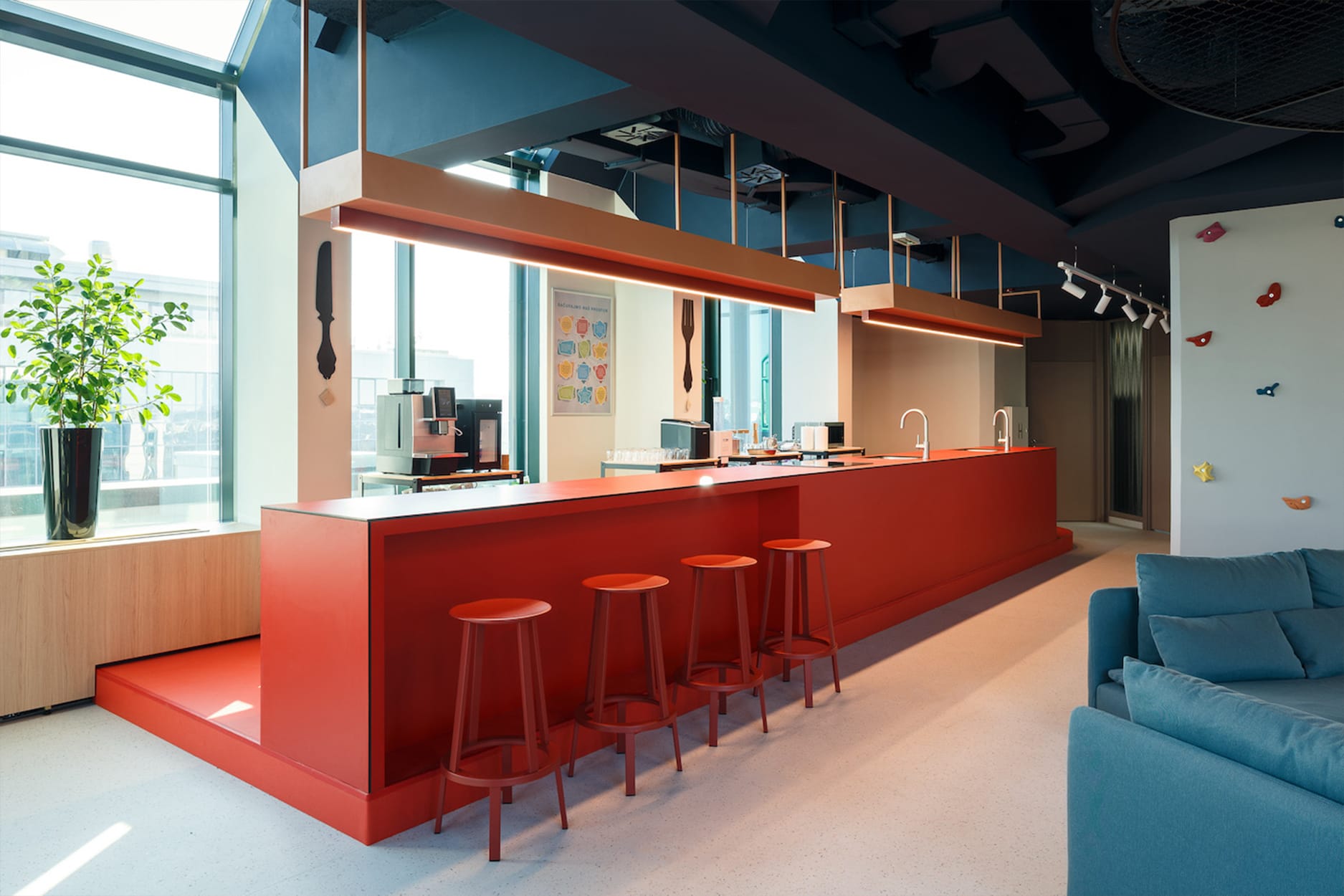 red bar counter with red stools in Generali office canteen interior