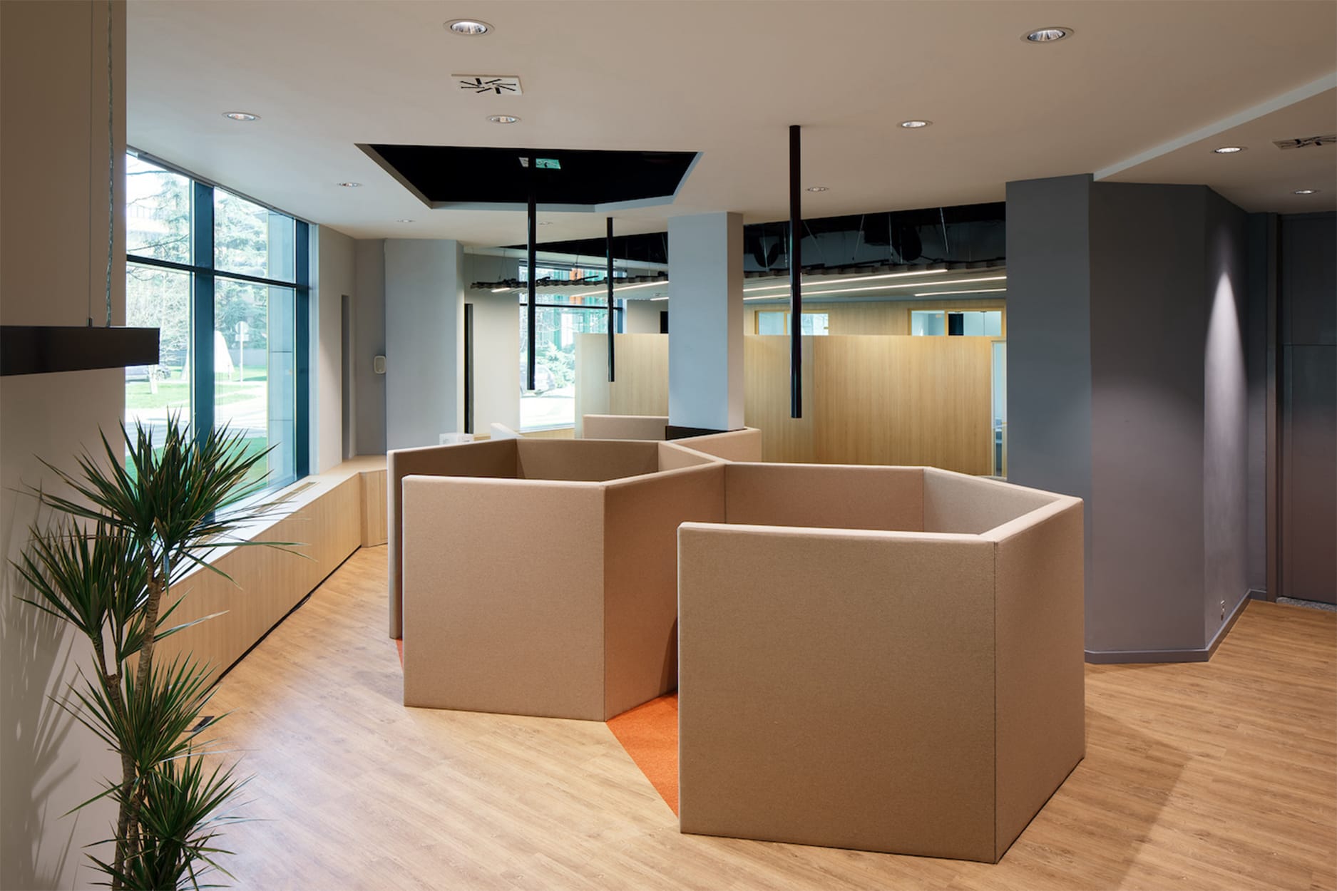 partition panels dividing service areas in Generali insurance branch interior